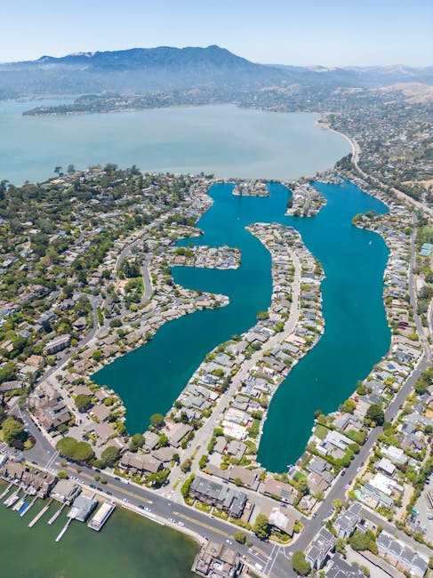 Stunning aerial photography capturing a beautiful coastal residential area by the bay.