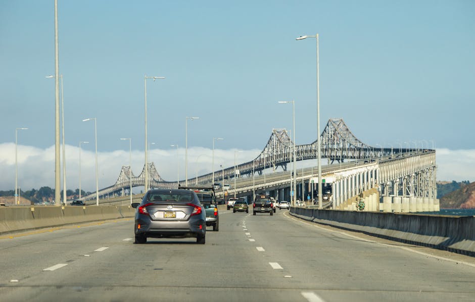 Vehicles travel on a sunny day across the Richmond-San Rafael Bridge.